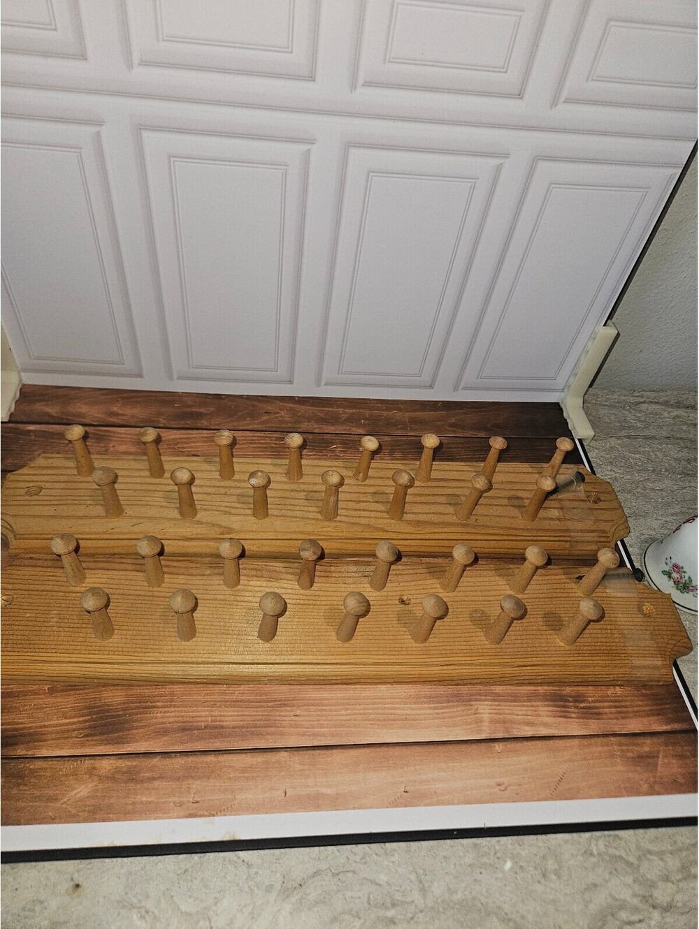 2 wooden peg hangers